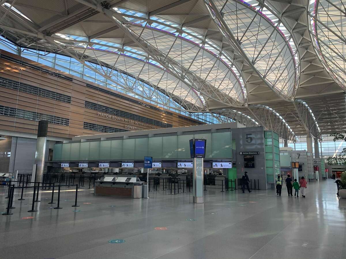 The departures hall at S.F. International Airport Terminal A is desolate — normally, it would be bustling.