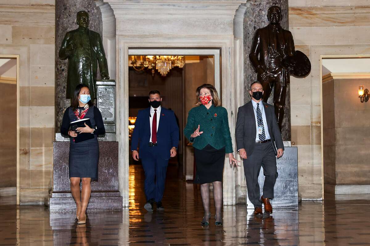 Nancy Pelosi, D-San Francisco, (second from right) heads to the House floor on Monday.