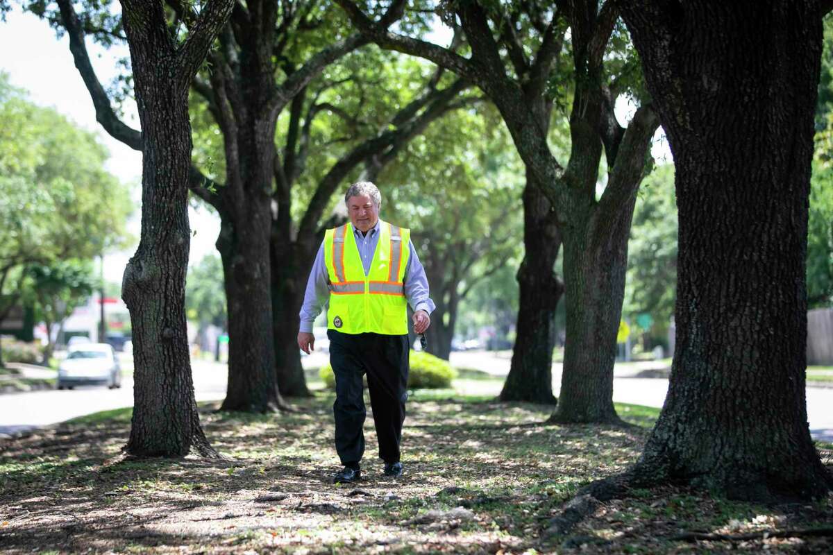 Councilman Greg Travis walks down a tree-line median along Kirkwood near Briar Forest Drive on Monday, May 11, 2020.