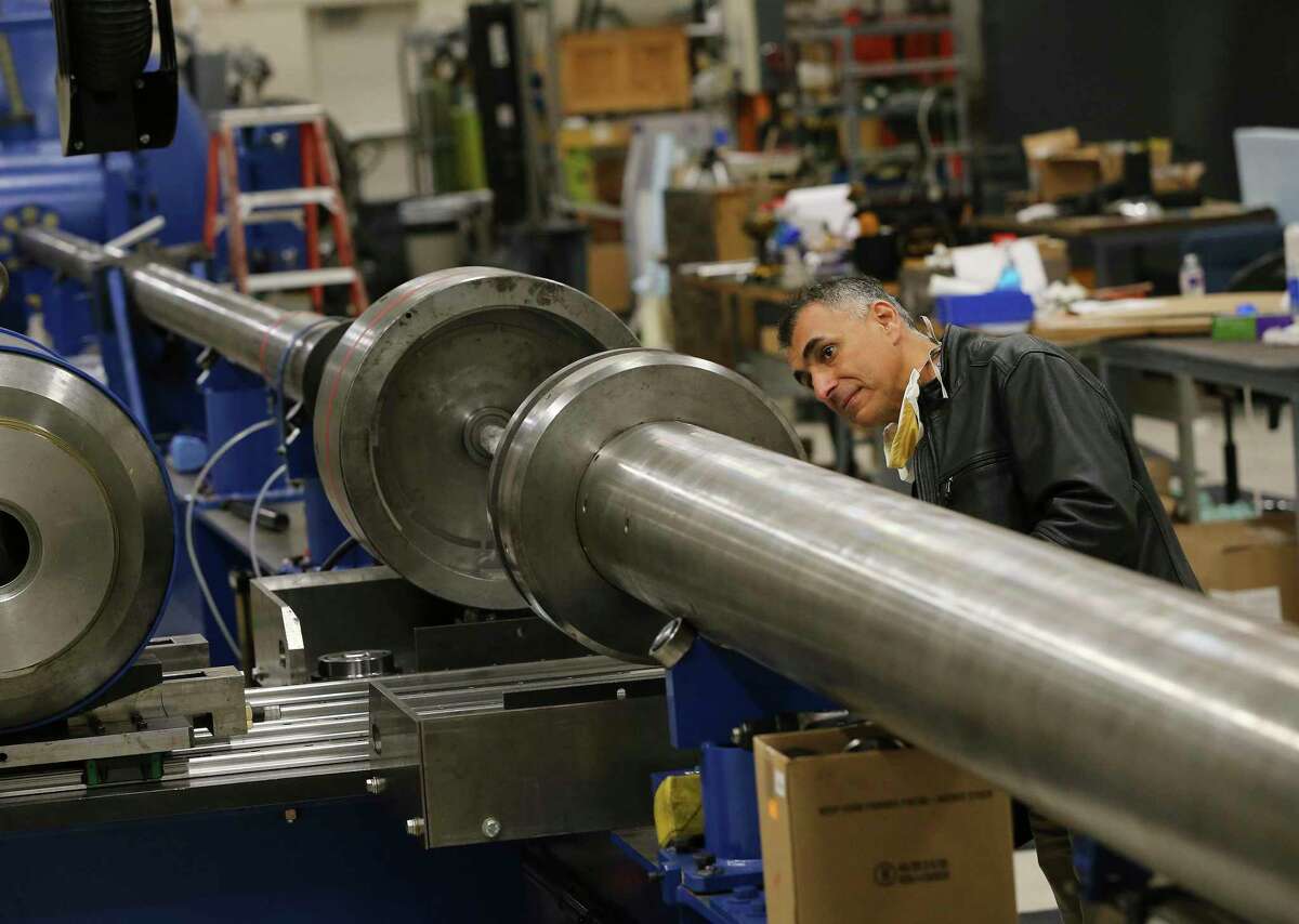 Southwest Research Institute is looking forward to the return of employees to campus and the breakthroughs that can foster. Here, Sidney Chocron checks a hydrogen gas gun last month