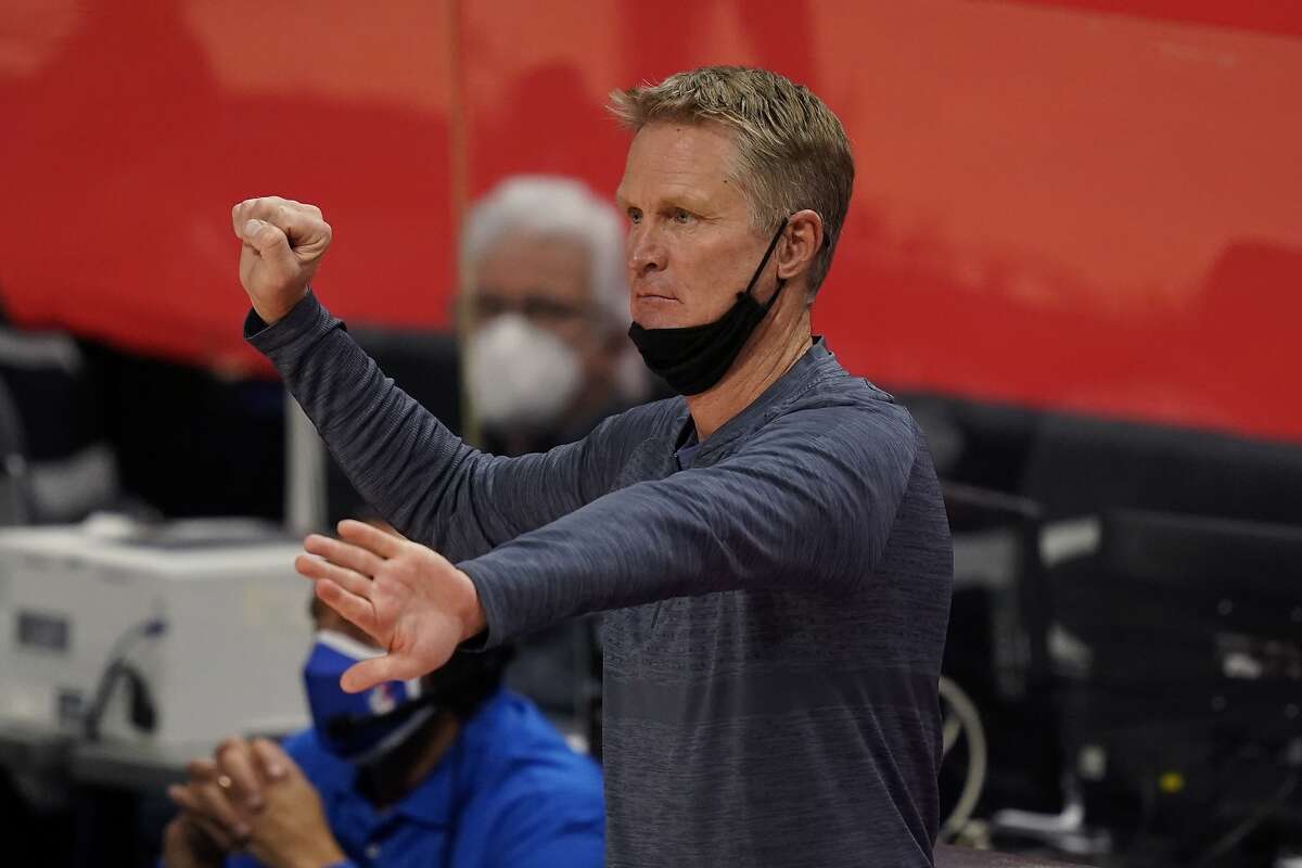 Golden State Warriors head coach Steve Kerr signals during the second half of an NBA basketball game against the Detroit Pistons, Tuesday, Dec. 29, 2020, in Detroit. (AP Photo/Carlos Osorio)