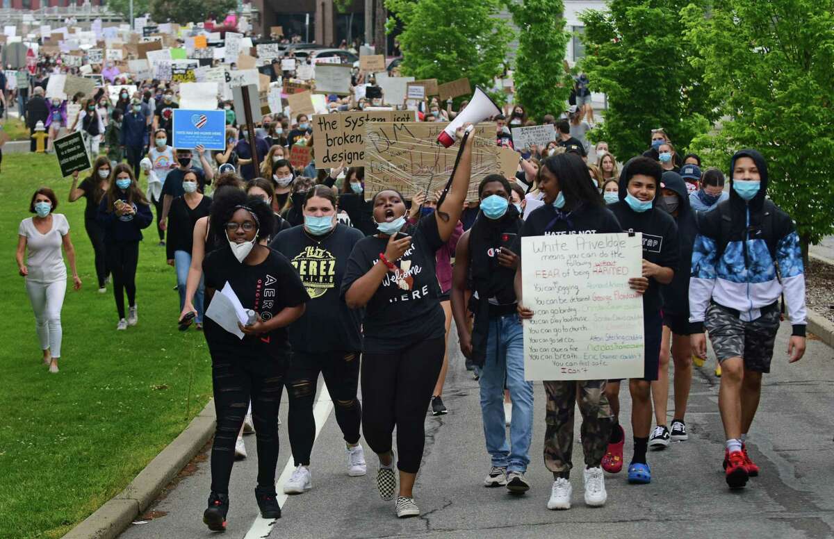 Several former and current Staples High School students organize a group of close to 1000 protestors Friday, June 5, 2020, in downtown Westport, Conn. The group marched from the Post Road bridge to the police station in a peaceful protest against police brutality.