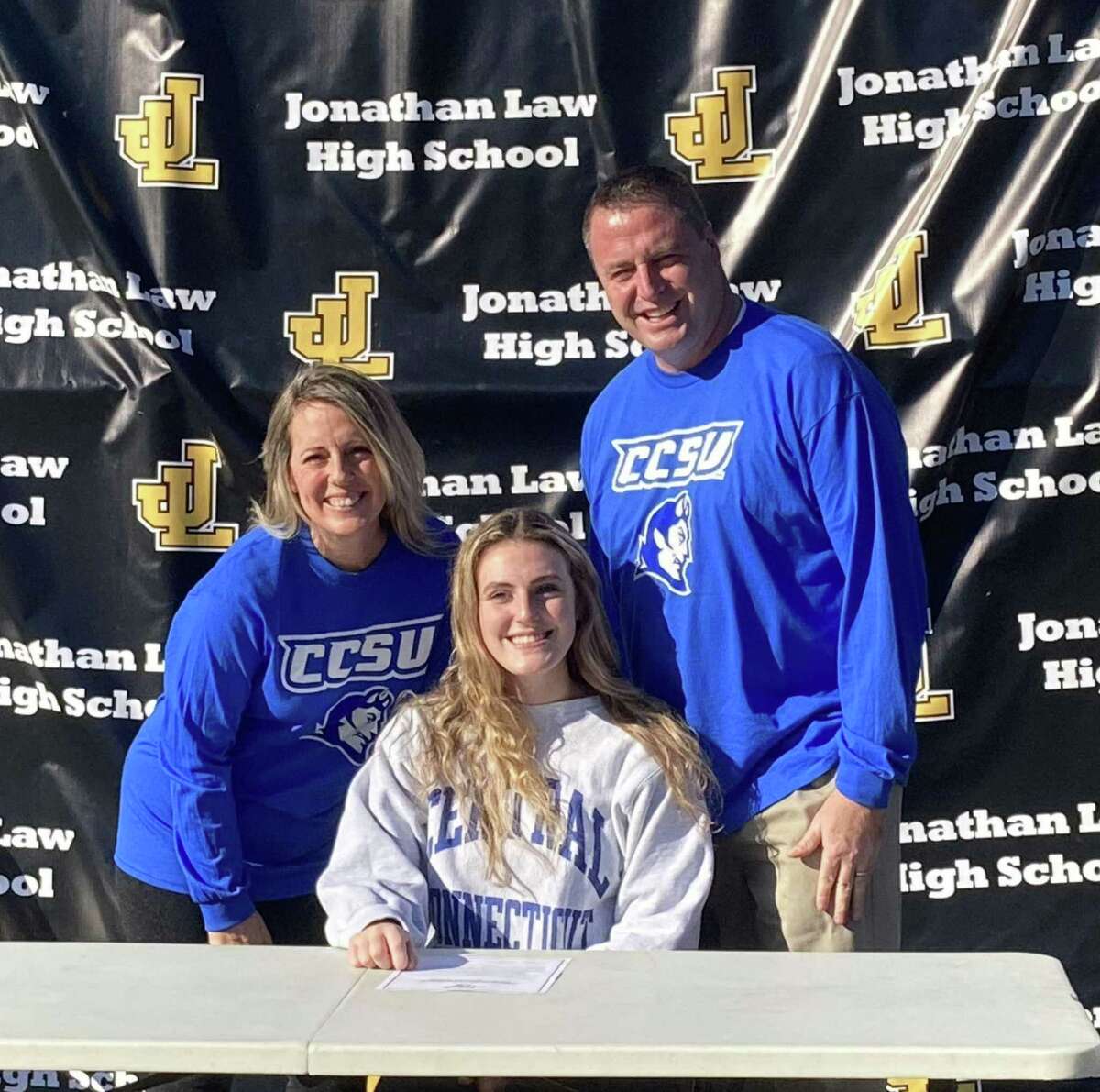 Law volleyball standout Alexis Neider is joined my parents John and Kelly when she signed to play for Central Connecticut State University in the Division I Northeast Conference.