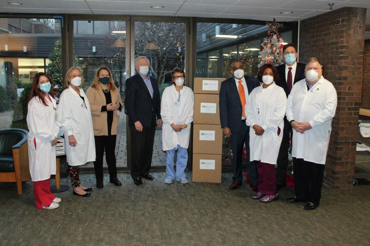 Connecticut Biotech donated 1,000 N95 masks to front line senior care and skilled nursing staff at Waveny LifeCare Network on Dec. 9. The donation was the first of several planned during the month by the company, according to Managing Director Bruce Morris. On hand to accept the gift were Jessica Aleixo, RN, Admissions Coordinator; Claudia Katz, RN, Director of Nursing; state Rep. Lucy Dathan (D-Norwalk and New Canaan); New Canaan First Selectman Kevin Moynihan; Laura Carreau, RN; Morris; CeCe Michel, RN; statre Rep. Tom O'Dea (R-New Canaan and Wilton), and Russell R. Barksdale Jr., president and CEO of Waveny LifeCare Network.