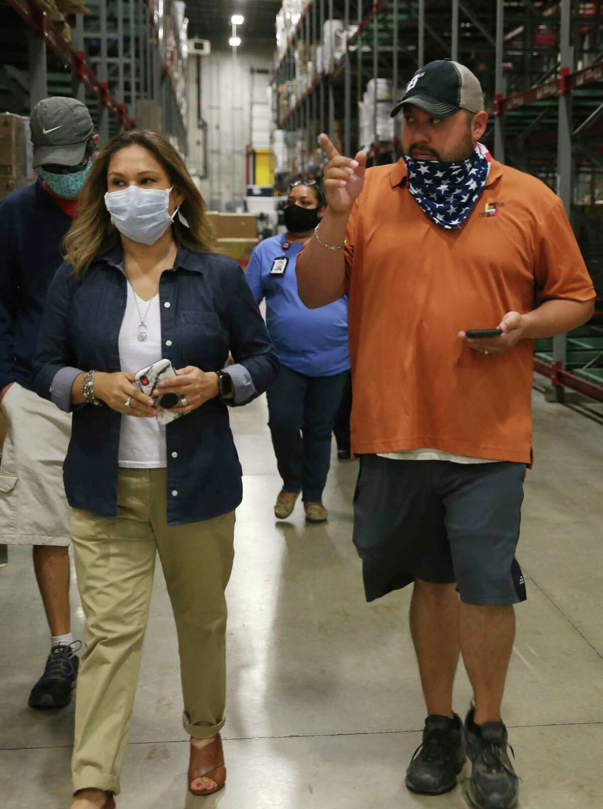 CRE8AD8 owner Gregorio Palomino walks out of the San Antonio Food Bank after five pallets of food boxes were delivered on Thursday, May 28, 2020.