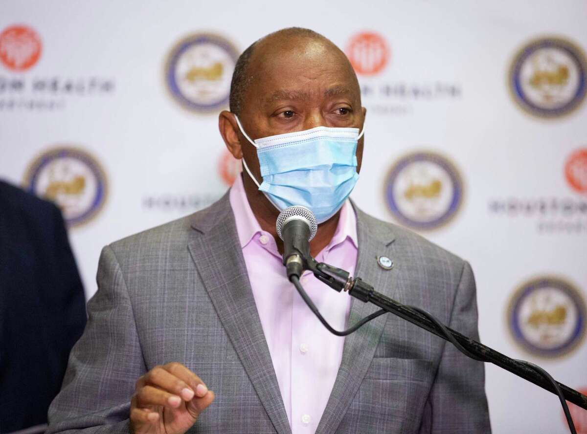 Houston Mayor Sylvester Turner encourages citizens to stay away from traditional New Year's celebration during the COVID-19 pandemic during a press conference Monday, Dec. 28, 2020, at a Harris Health clinic in Houston.