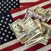 Stimulus cash that was part of the coronavirus relief package will continue to roll out via direct deposit and actual checks in April and early May, though some may get their money later. (Susan Tompor/Detroit Free Press/TNS)