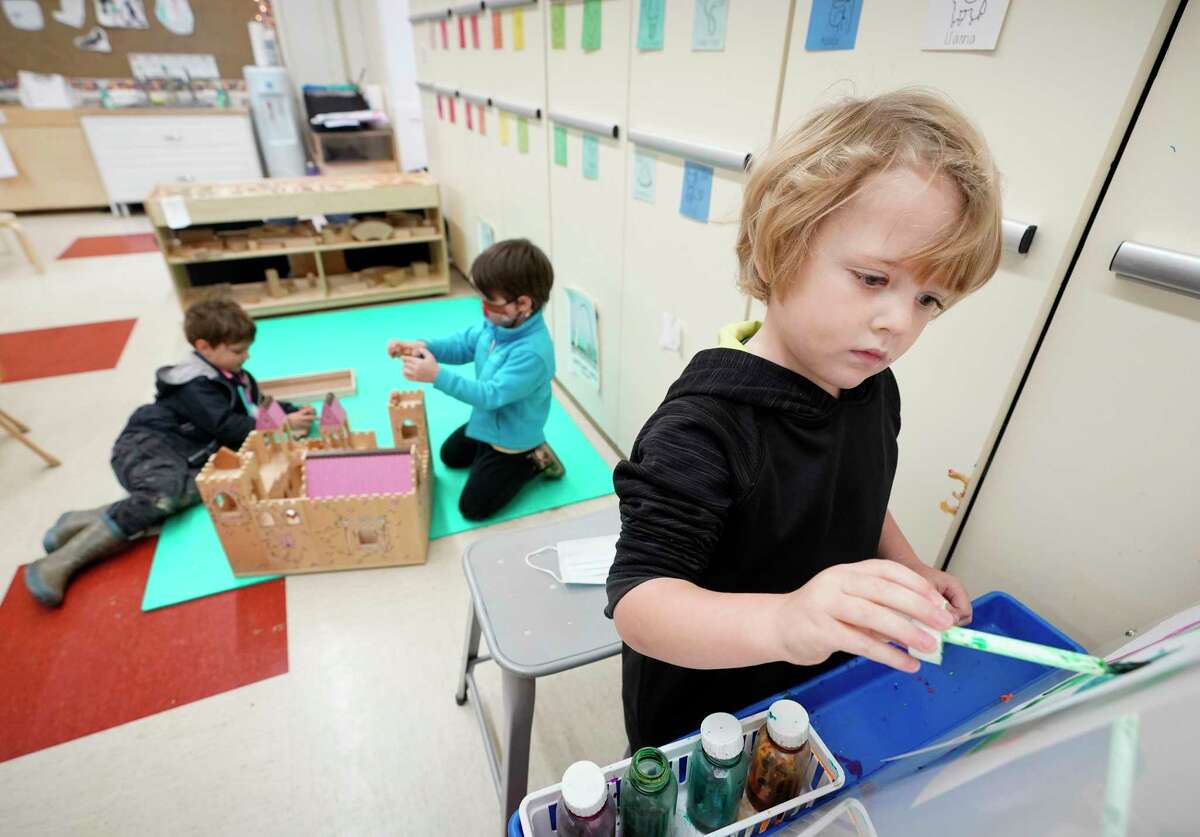 Henry Christenson, 4, paints during pre-kindergarten class at the Beehive Parent Child Center, 3756 University Blvd., Thursday, Dec. 17, 2020 in Houston. The cooperative is on the campus of West University Elementary School. Houston ISD is ending its partnership with several private early education organizations operating out of district campuses.