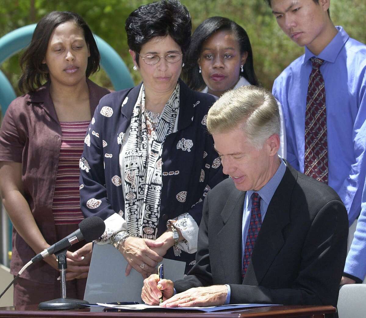 Rita Saenz (second from left) ran the California Department of Social Services under Gov. Gray Davis. She is returning to government to run the troubled Employment Development Department.