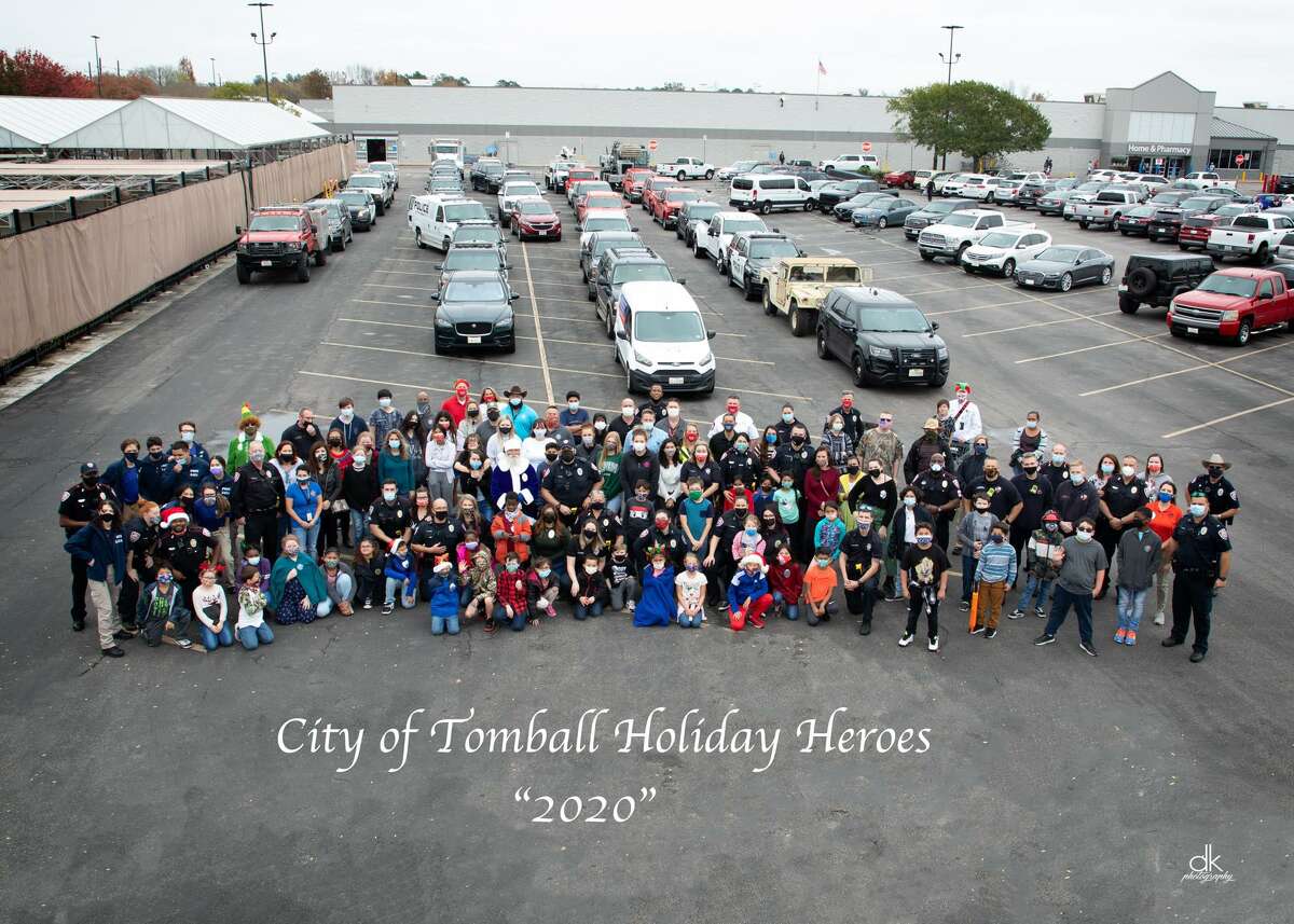 Tomball police officers, firefighters and public works employees come together to provide gifts to families in need for Christmas as part of their first Holiday Heroes event.