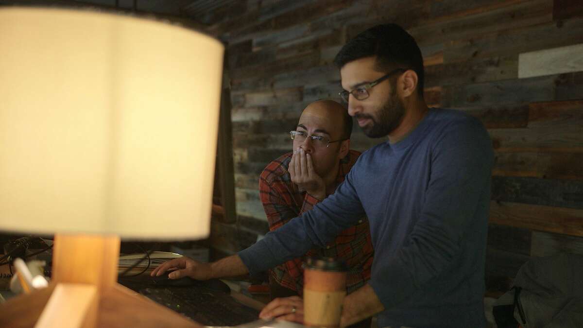 Supergiant's Greg Kasavin, left, and Amir Rao working at the company's San Francisco studio.