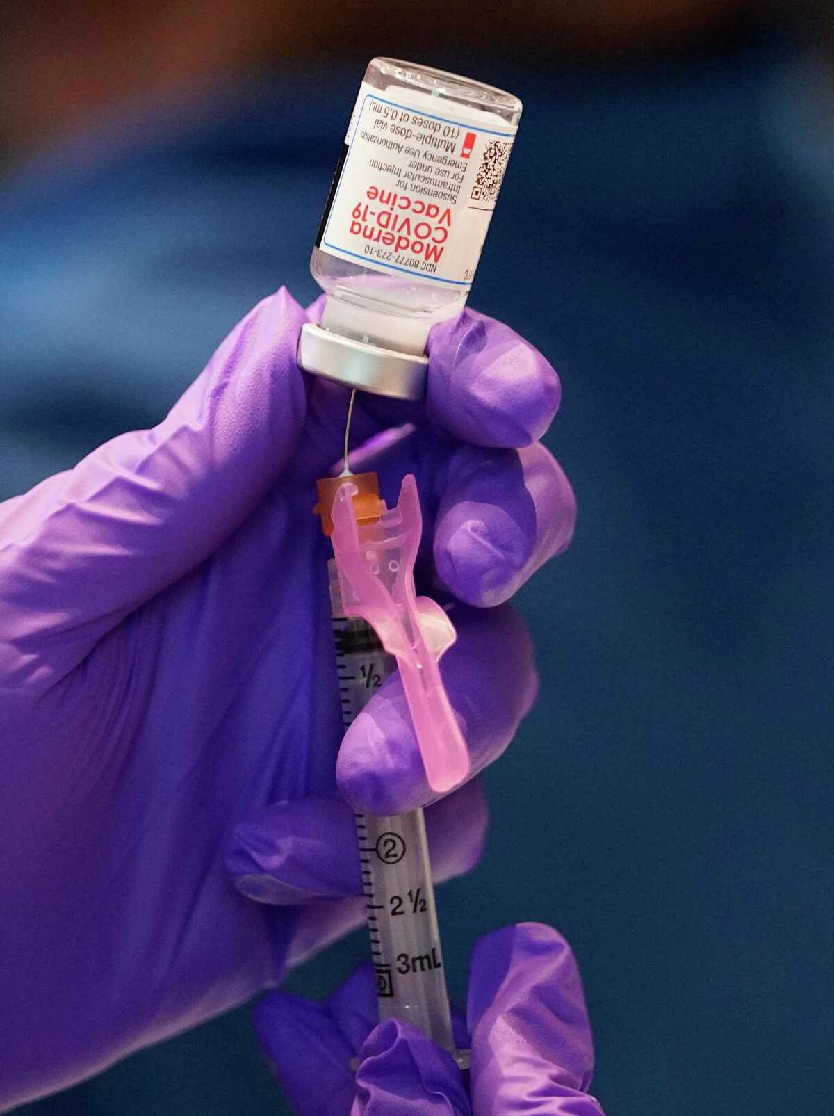 A Moderna COVID-19 vaccination is prepared at McGovern Medical School at UTHealth Wednesday, Dec. 30, 2020 in Houston.