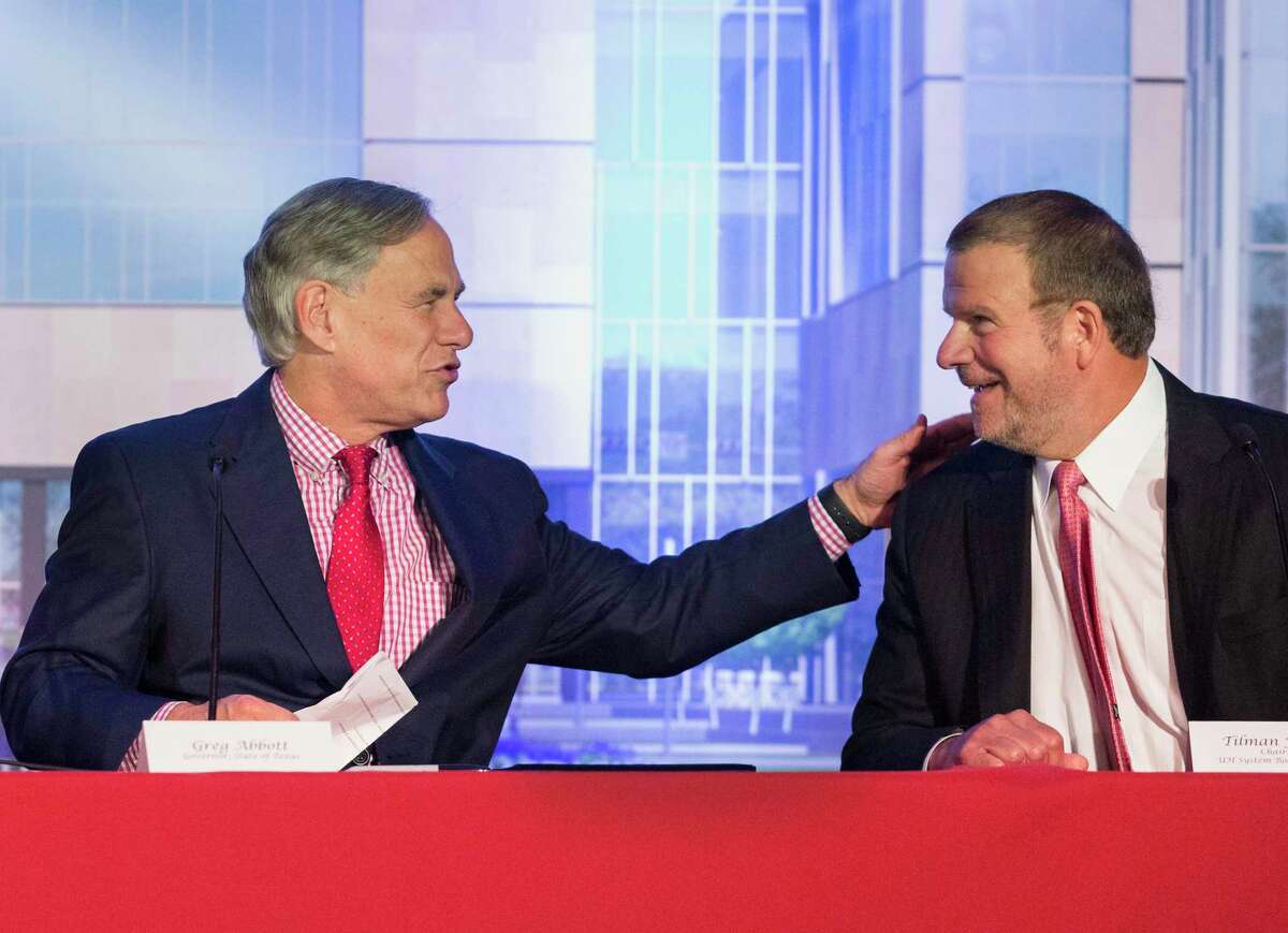 Gov. Greg Abbott and Tilman Fertitta, University of Houston System Board of Regents chairman, greet each other at the University of Houston College of Medicine bill signing ceremony on Wednesday, Aug. 21, 2019, in Houston. Abbott, who officially signed HB826 bill into law in May, signed the bill again during the ceremony.