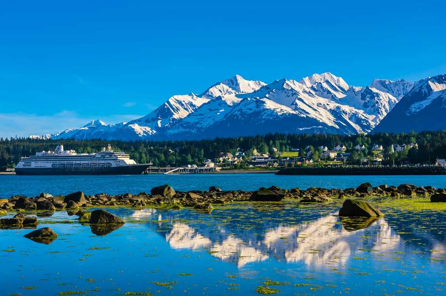 Holland America Line's cruise ship "Zaandam" in port at Haines, Alaska USA. Rising high above the town are the Takinsha Mountains and Chilkat Range to the south, Takshanuk Mountains to the north and Coast Mountains to the east across the Lynn Canal. Photo: Blaine Harrington III/Getty Images / Copyright 2016 Blaine Harrington III ALL RIGHTS RESERVED