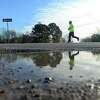 Runners and walkers make loops through Tyrrell Park as they join in Sea Rim Striders' annual Resolution Run 5K New Year's Day. Photo taken Friday, January 1, 2021 Kim Brent/The Enterprise