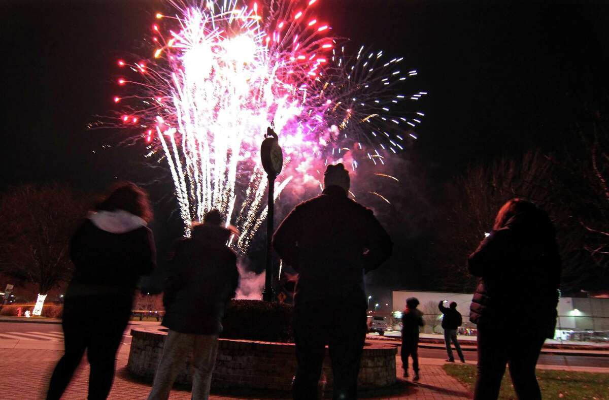 Fireworks are held to help ring in the new year at Veterans' Riverwalk Park in Shelton, Conn., on Thursday Dec. 31, 2020.
