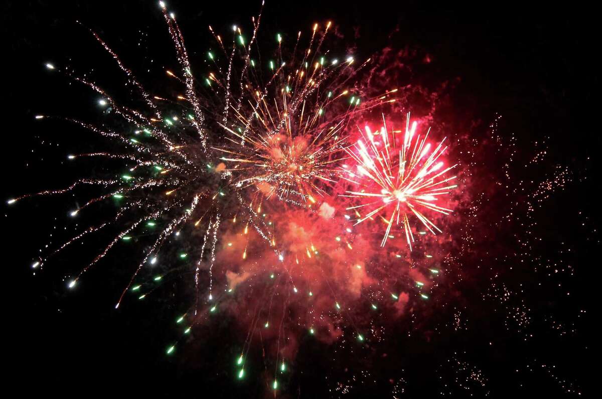 Fireworks are held to help ring in the new year at Veterans' Riverwalk Park in Shelton, Conn., on Thursday Dec. 31, 2020.