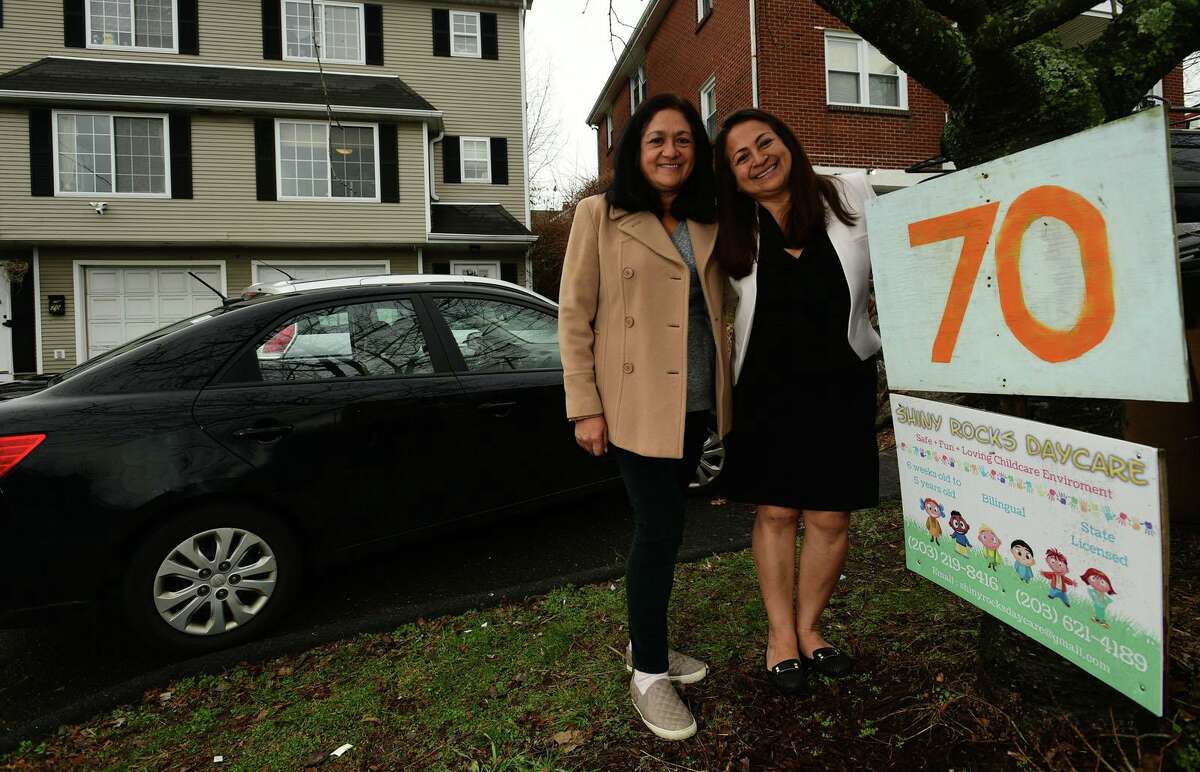 Gladys Contreras and her sister Dora Ramos in front of their daycare facility Thursday, December 31, 2020, in Stamford, Conn.