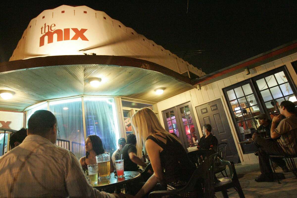 Patrons sit outside and have drinks at St. Mary's Strip venue The Mix, co-owned by Blayne Tucker.