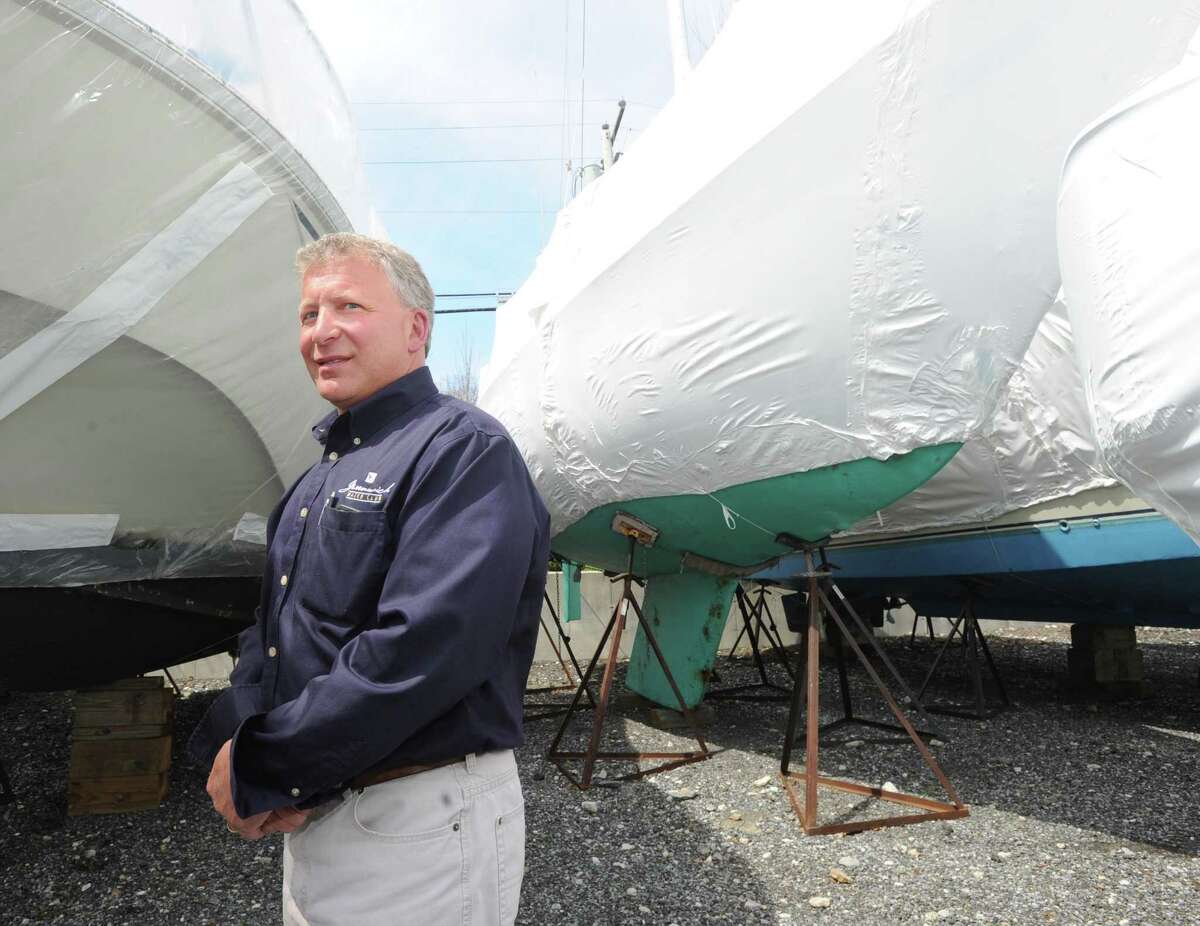 Greenwich Athletic Foundation Co-President and Beacon Point Marine President Rick Kral, stands by a sailboat with a keel that he said has a six-foot draft when in the water at Beacon Point Marine in the Cos Cob section of Greenwich, Conn., Wednesday, April 22, 2015.