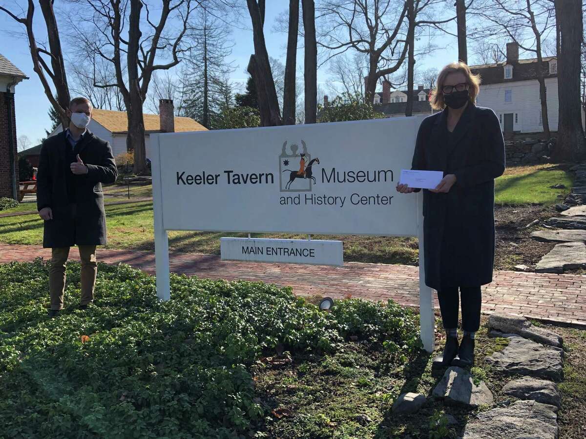 Antony Tokarr, who is the branch manager of Ridgefield's M&T Bank location in the town, recently presented the Keeler Tavern Museum and History Center's Executive Director Hildegard Grob with a $5,000 sponsorship of the Museum and History Center's history programs for a Title 1 School Students project. Pictured are: Tokarr, and Grob.
