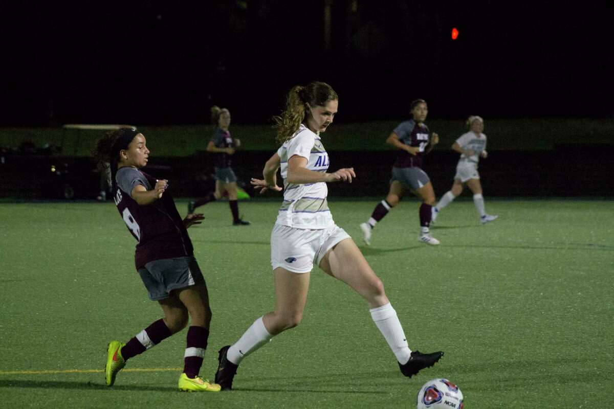 Albertus Magnus’ Megan Doyle, right, may have lost her fall soccer season, but the junior has been busy advancing her career in social media marketing.