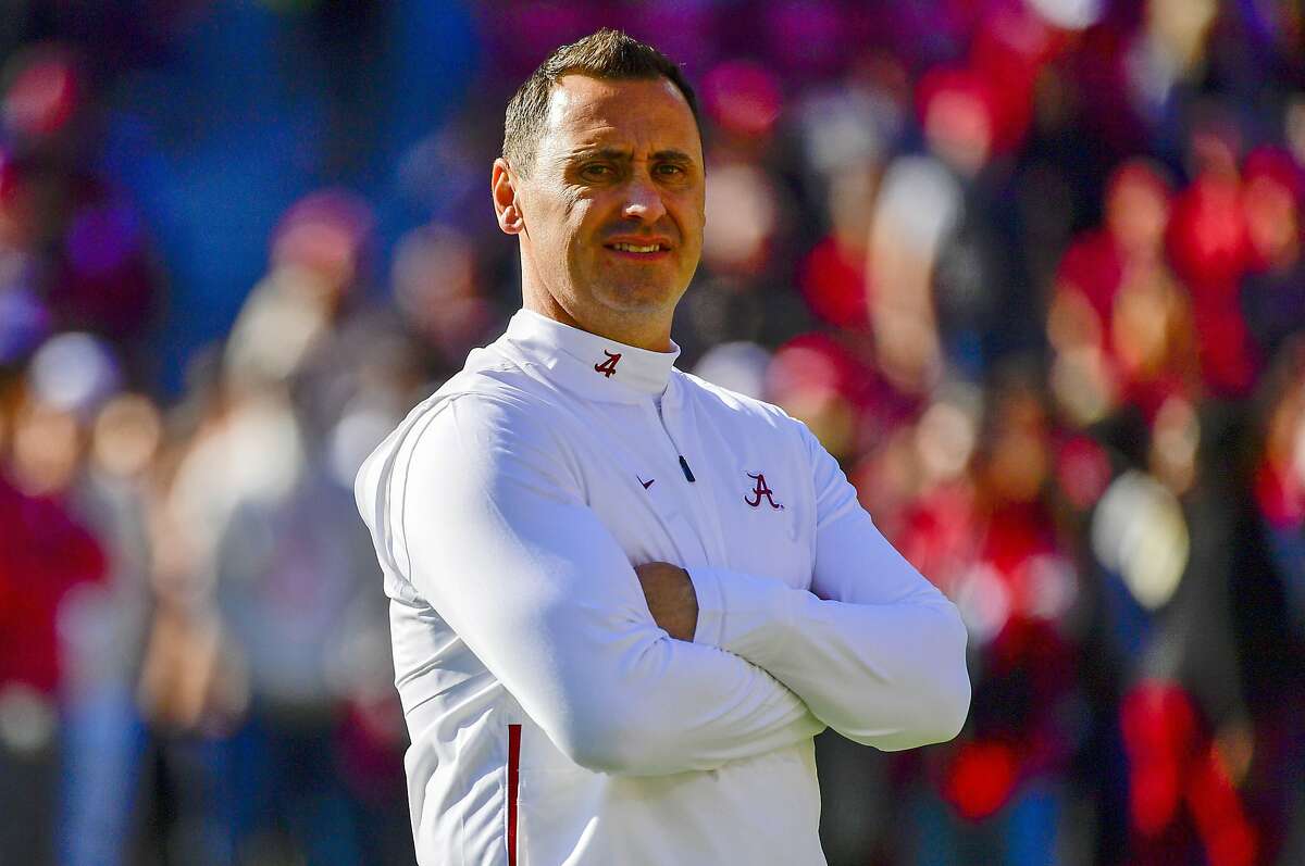FILE - In this Nov. 9, 2019, file photo, Alabama offensive coordinator Steve Sarkisian watches warmups before an NCAA football game against LSU in Tuscaloosa, Ala. Texas has hired Sarkisian as the Longhorns new coach. The move comes just a few hours after Texas announced the firing of Tom Herman after four seasons with no Big 12 championships. (AP Photo/Vasha Hunt, File)