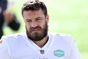 EAST RUTHERFORD, NEW JERSEY - NOVEMBER 29:  Ryan Fitzpatrick #14 of the Miami Dolphins is on the field for warm ups before the game against the New York Jets at MetLife Stadium on November 29, 2020 in East Rutherford, New Jersey.The Miami Dolphins defeated the New York Jets 20-3.