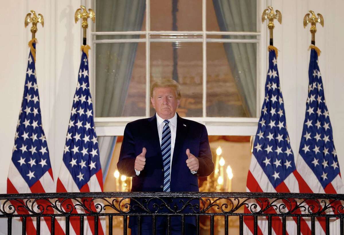 U.S. President Donald Trump gives a thumbs up after returning to the White House from Walter Reed National Military Medical Center on Oct. 5, 2020, in Washington, D.C. Trump spent three days hospitalized for coronavirus. (Win McNamee/Getty Images/TNS)
