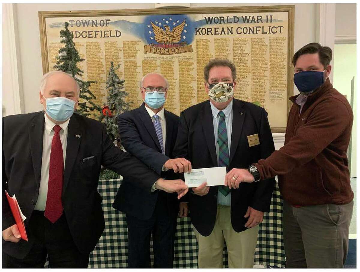 Danbury Elks Lodge #120 recently presented the Ridgefield Food Pantry with a donation of $1,750 to assist in serving people in need in the surrounding communities during the current difficult times of the coronavirus pandemic. The Benevolent and Protective Order of Elks, (BPOE), is a National Fraternal Organization established in 1868. It currently with 2000 lodges across the U.S. with a million members, whose mission is community welfare, and promoting American patriotism through local, and National programs, and grants. Pictured left to right are: Loyal Knight Alex Karsanidi, Ridgefield First Selectman Rudy Marconi, Exalted Ruler Ray Ward, and Director Social Services Tony Phillips.