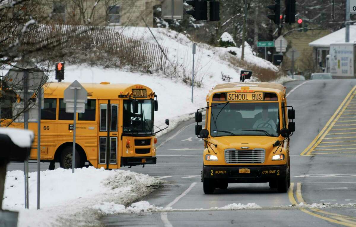 School buses are driven out onto Watervliet Shaker Rd. after leaving Shaker High School on Monday, Jan. 4, 2021, in Colonie, N.Y.(Paul Buckowski/Times Union)