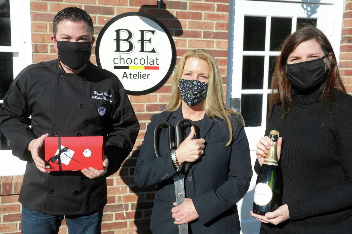 First Selectwoman Brenda Kupchick joins BE Chocolat owners Benoit Racquet and Sylvie Fortin for a ribbon cutting in front of the new store and workshop in Fairfield, Conn. Jan. 4, 2021.