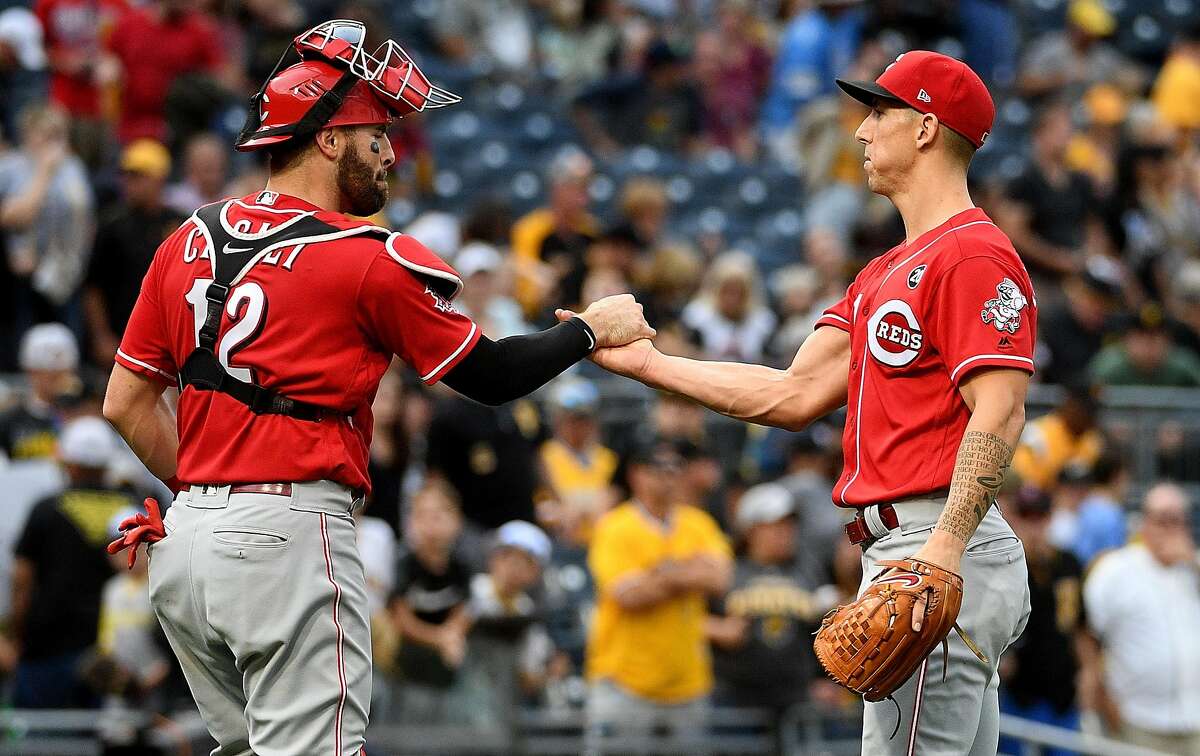 PITTSBURGH, PA - SEPTEMBER 29: Michael Lorenzen #21 of the Cincinnati Reds celebrates with Curt Casali #12 after the final out in a 3-1 win over the Pittsburgh Pirates at PNC Park on September 29, 2019 in Pittsburgh, Pennsylvania. (Photo by Justin Berl/Getty Images)