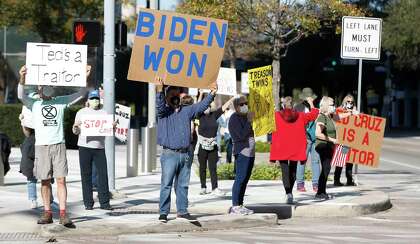 Members of the Protect The Results coalition hold a protest against Ted Cruz, Monday, Jan. 4, 2021, at Mickey Leland Federal Building in Houston . The protest is an expression of concern from Houstonians that anti-democratic extremists, led in part by Ted Cruz, believe in overturning the outcome of the 2020 election.