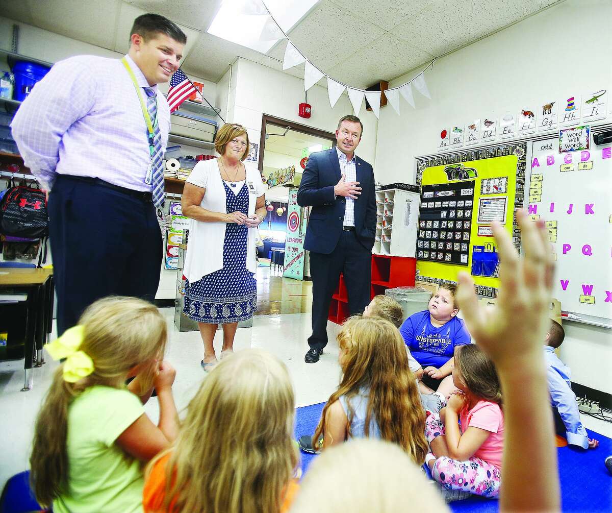 Sen. Andy Manar (right), D-Bunker Hill, visits a first-grade classroom last year at Brighton North Primary School with school Principal Diane Milnor (center) and superintendent Brad Skertich.