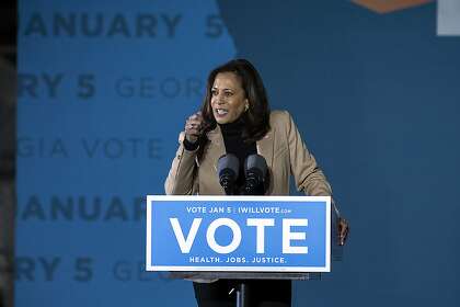 Vice President-elect Kamala Harris speaks at a drive-in rally in Savannah, Ga., during a campaign stop for Democratic candidates.