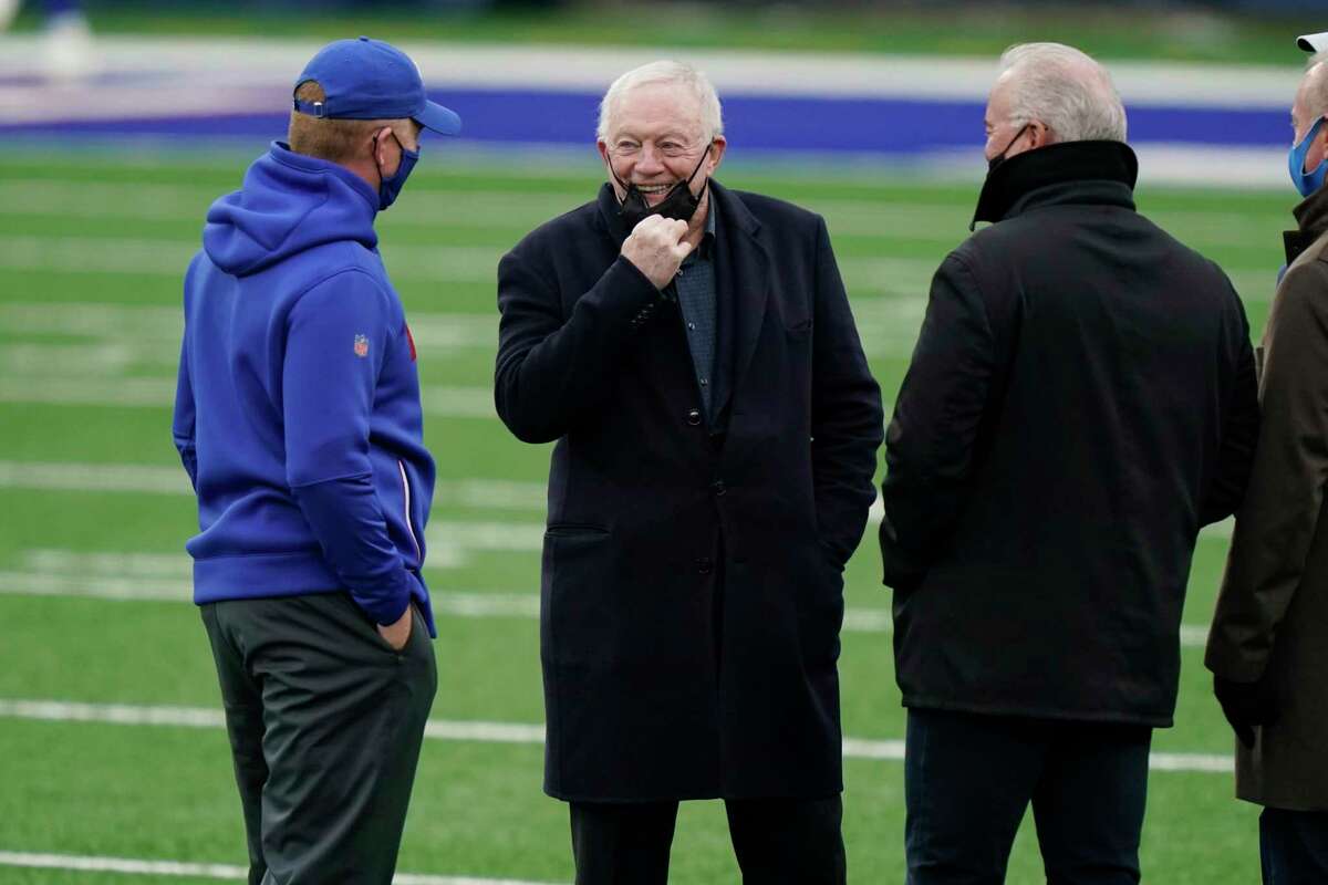 Dallas Cowboys owner Jerry Jones talks with people on the field before an NFL football game between the New York Giants and the Dallas Cowboys, Sunday, Jan. 3, 2021, in East Rutherford, N.J. (AP Photo/Corey Sipkin)