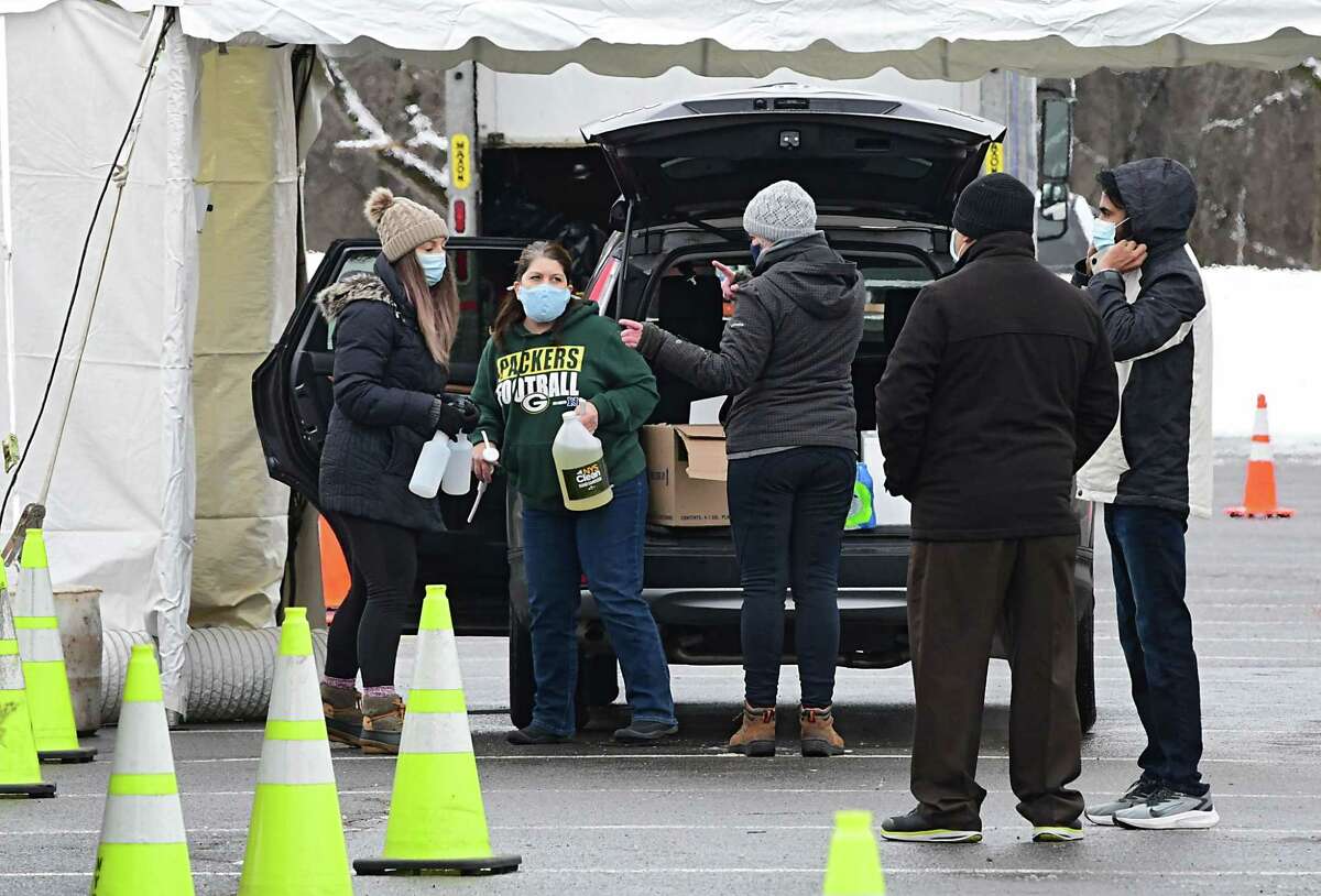 Workers set up a state testing site in Saratoga Spa State Park to provide COVID-19 testing for N. Fox jewelry customers on Monday, Jan. 4, 2021 in Saratoga Springs, N.Y. The first New York case of the U.K. coronavirus strain was detected in a man who works at the jewelry store on Broadway. (Lori Van Buren/Times Union)