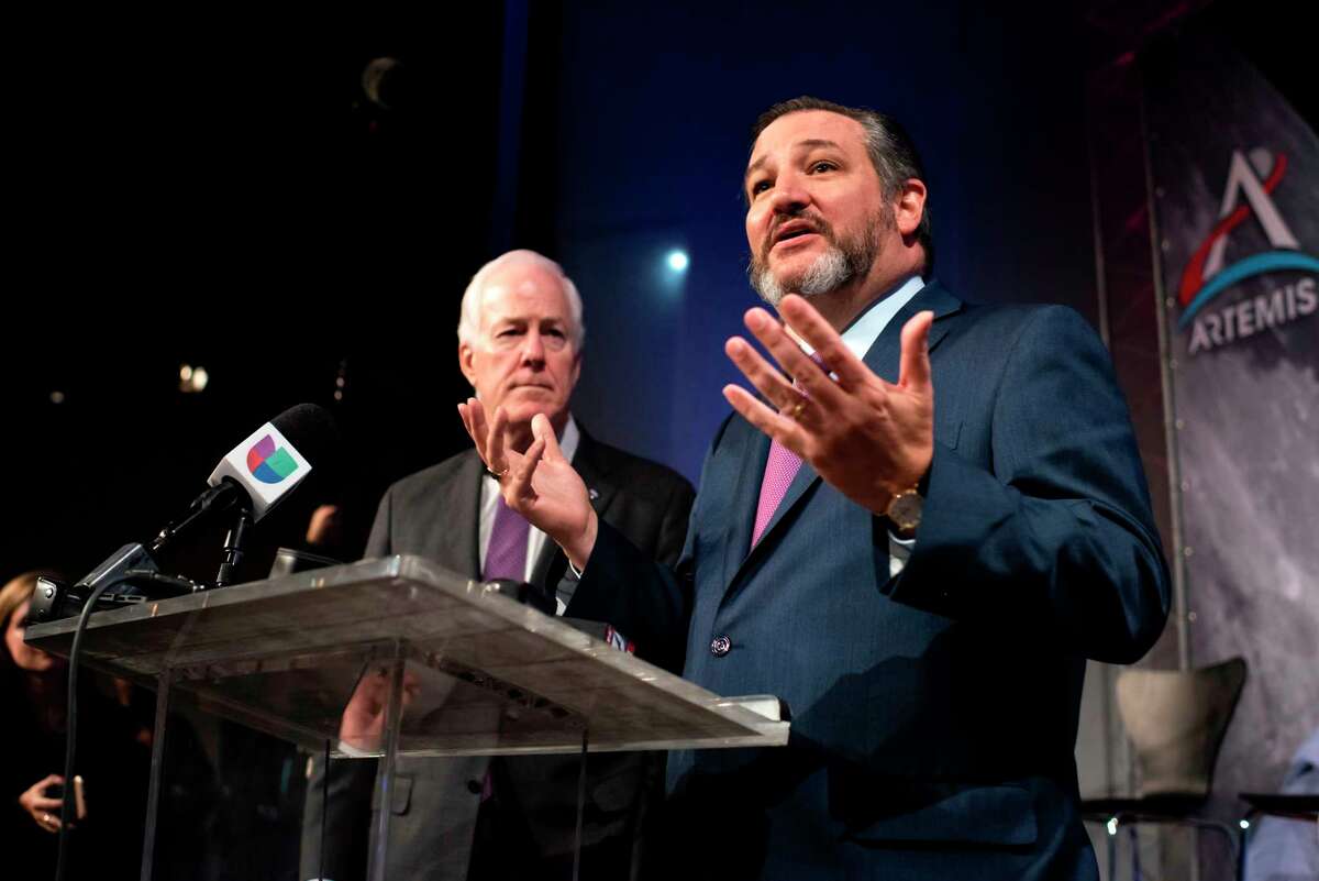 U.S. Sens. Ted Cruz, right, and John Cornyn take part in the astronaut graduation ceremony at Johnson Space Center in Houston Texas, on Jan. 10, 2020. (Mark Felix/AFP/Getty Images/TNS)