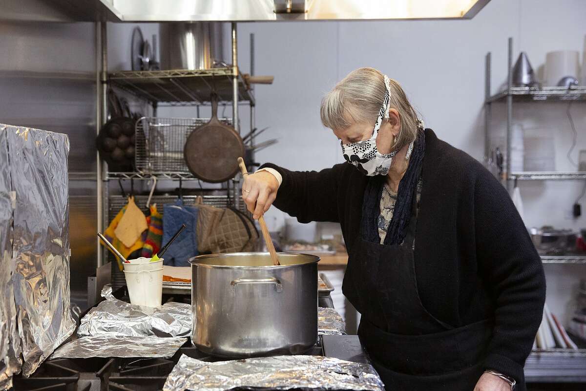 June Taylor stirs a pot of Meyer lemon skins that will be made into candy at her kitchen in Berkeley, Calif. on Monday, January 4, 2021. After 17 years in her current space and over 30 years of preserving, June Taylor is going to be closing down her business and kitchen.