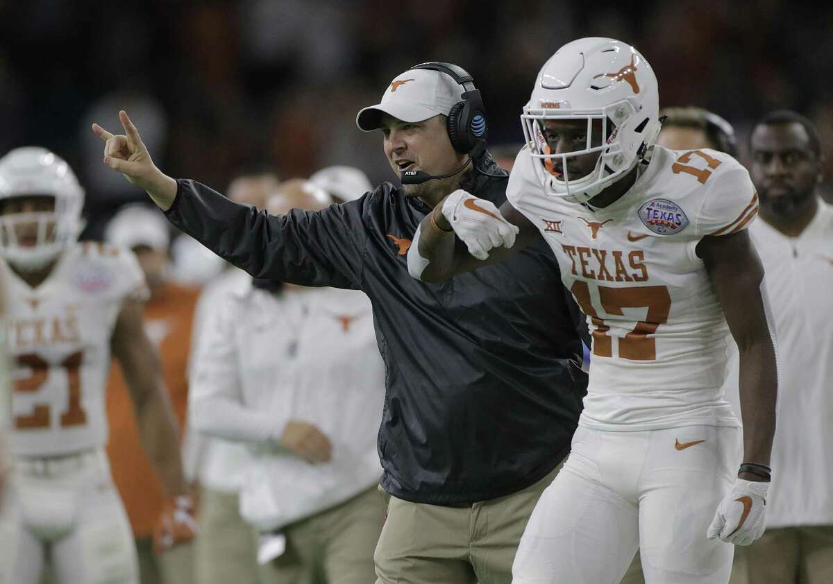 Texas Longhorns head coach Tom Herman celebrates after the team's first touchdown in the first quarter of the The Academy Sports + Outdoors Texas Bowl against Missouri at NRG Stadium on Wednesday, Dec. 27, 2017, in Houston. ( Elizabeth Conley / Houston Chronicle )