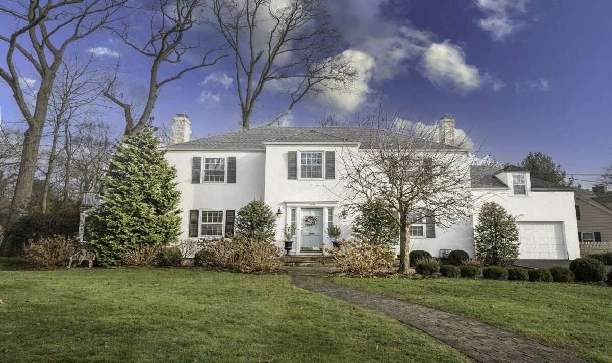 The stucco and masonry colonial house at 139 Northwood Road, Fairfield is in the Stratfield neighborhood. What better way to start off the New Year than with a new home? And this one sits on a 0.64-acre level property; an oversized parcel in the Stratfield neighborhood. The size of the lot is not the only thing that sets this property apart. This house was built in 1941, and while it has received updates it still retains some of its original charm from that era. “The unique vintage craftsmanship and mill work is not often found in today’s modern builds,” the agent said. “The moment you step inside you are greeted with a dramatic entry with a stunning spiral staircase. Expansive rooms, nine-foot-plus ceilings, hardwood floors, built-ins and a thoughtfully designed floor plan are just the beginning of what this amazing home offers,” she said.