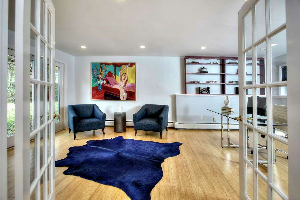 The lower level at 6 Peaceful Lane, Westport features a home office or media room or potential fifth bedroom. There are four bedrooms on the main level and the potential for a fifth bedroom on the finished lower level. This oversized space also could serve as a home office or in-law or au pair suite with its own private entrance. French doors separate the game room from the office. Also on this level is a half bath, a good-sized laundry room with a sink, counter space and cabinets. There is loads of storage, and an ample mudroom conveniently located next to the large attached two-car garage. “Welcome home,” the agent said.
