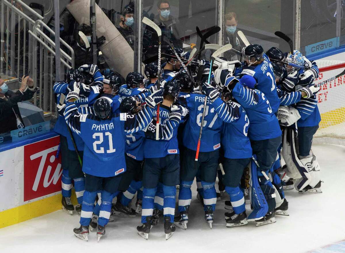 Finland celebrates a win over Russia in the third-place game in the IIHF World Junior Hockey Championship, Tuesday, Jan. 5, 2021, in Edmonton, Alberta. (Jason Franson/The Canadian Press via AP)