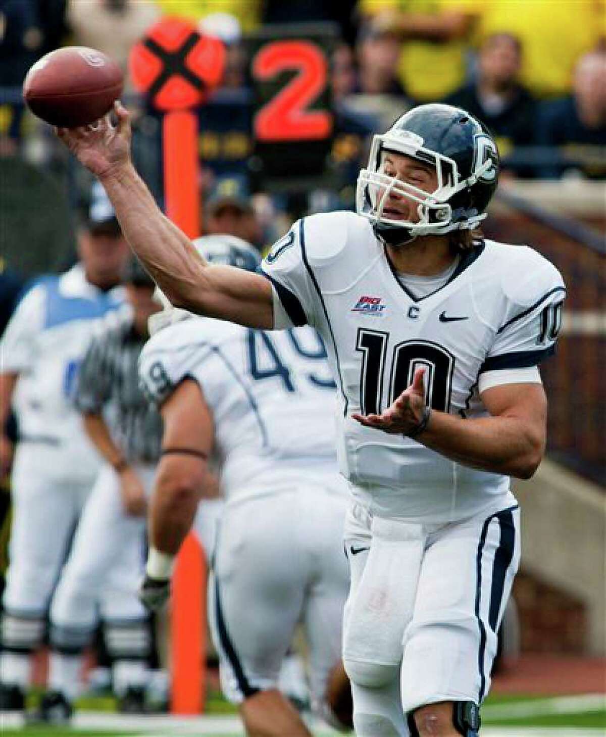 Connecticut quarterback Zach Frazer throws a pass in the second quarter of an NCAA college football game against Michigan, Saturday, Sept. 4, 2010, in Ann Arbor, Mich. (AP Photo/Tony Ding)