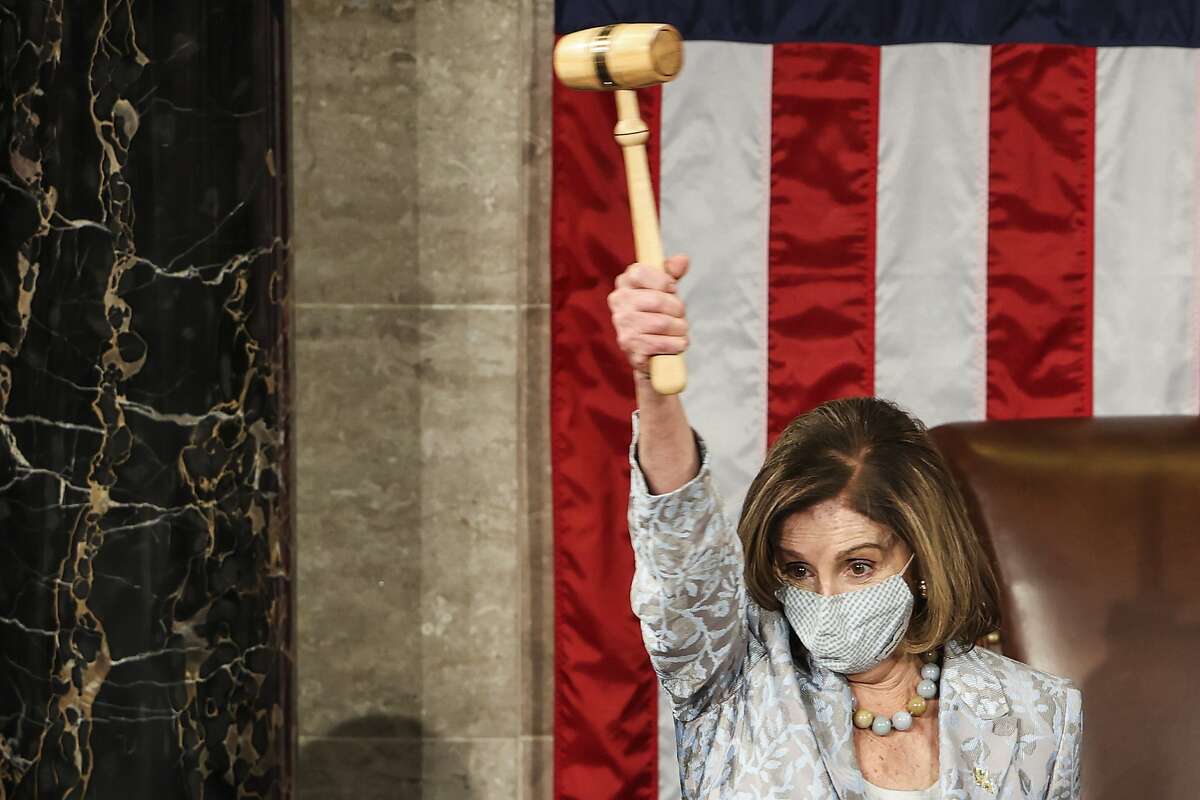 House Speaker Nancy Pelosi waves the gavel during opening day of the 117th Congress at the U.S. Capitol in Washington on Sunday.