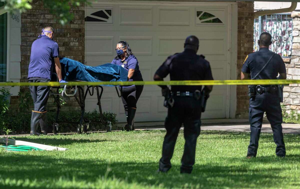 The body of one of the two people killed June 11, 2020, is removed from a home in the 5000 block of Round Table Drive. A 50-year-old woman shot and killed her parents at the home before turning the gun on herself, San Antonio Police Chief William McManus said.