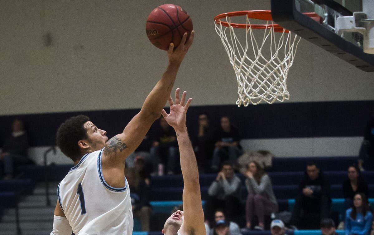 Northwood's Evan Lowden takes it to the rim during a March 3, 2020 GLIAC Tournament quarterfinal against Davenport.