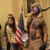 Face-painted man in horned fur cap at Capitol riot supports Trump