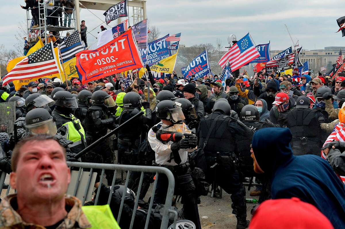 Trump supporters clash with police and security forces as people try to storm the U.S. Capitol in Washington, D.C., on Jan. 6, 2021. Demonstrators breached security and entered the Capitol as Congress debated the 2020 presidential election electoral vote certification.